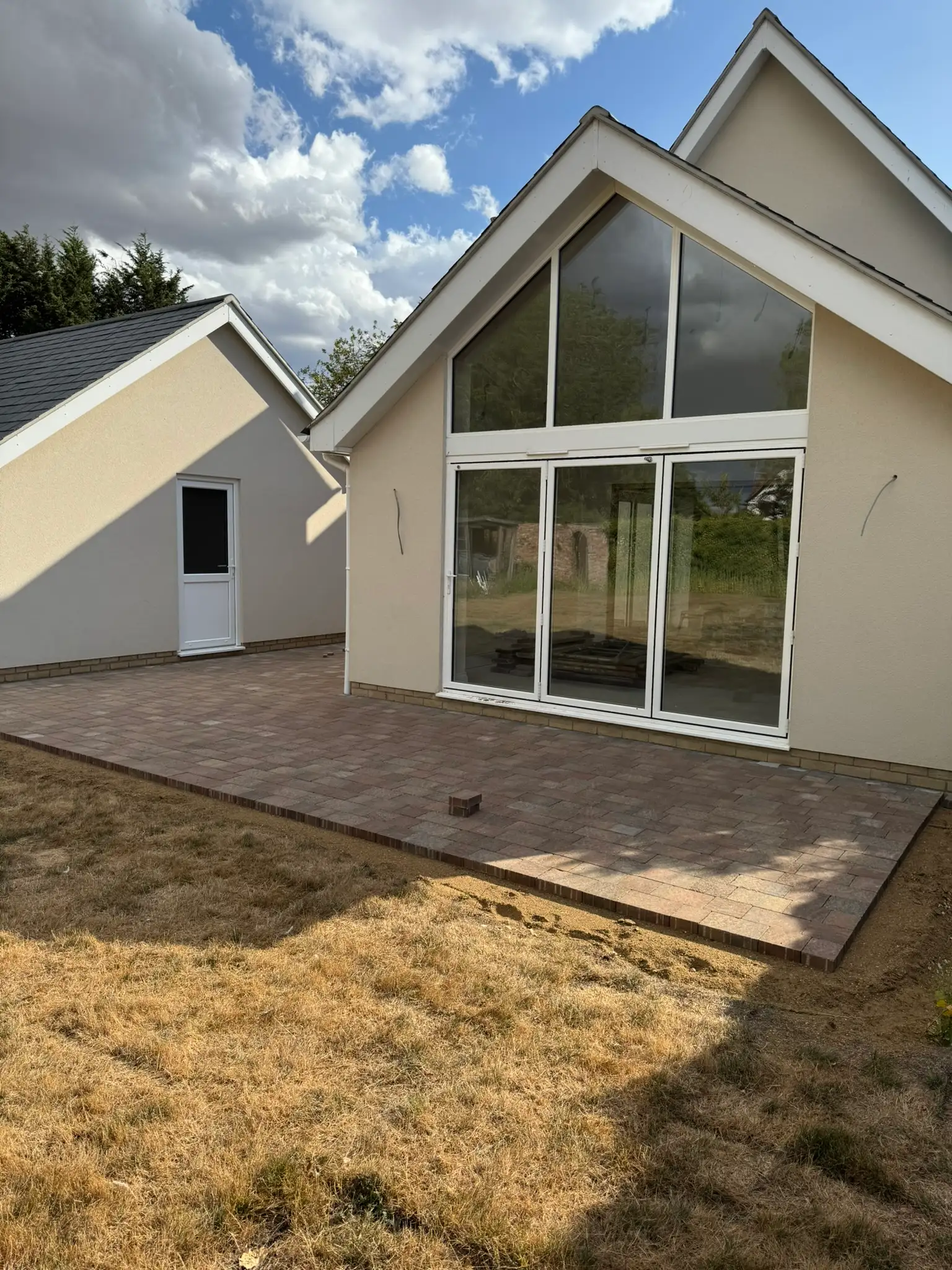 New build with a full height glazed gable by Ablewood